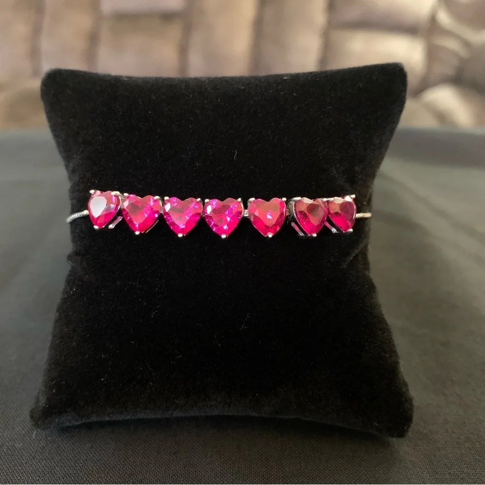 Rhodium over sterling silver lab ruby heart bolo bracelet